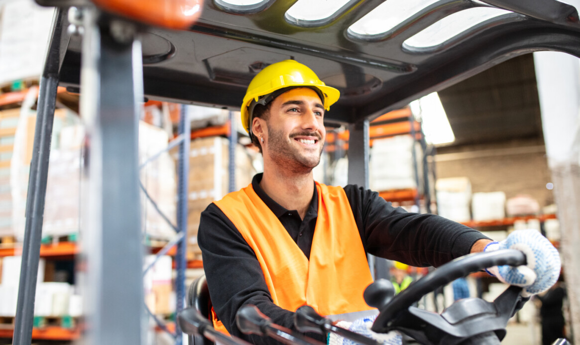 Warehouse worker operating a forklift