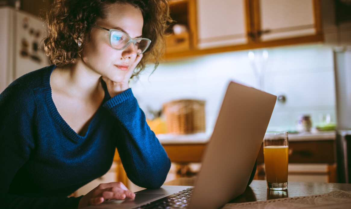 Woman working on laptop at home