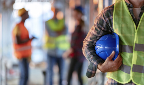 Man holding blue helmet close up