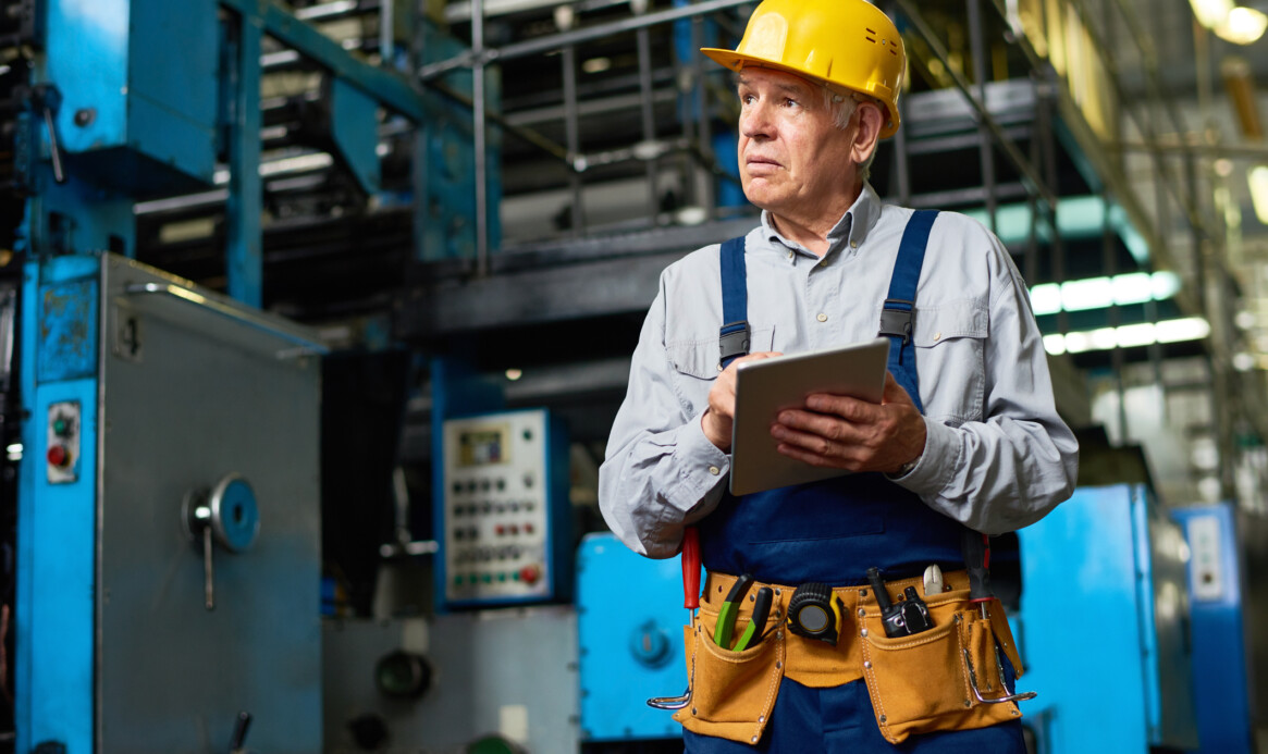 Senior Factory Worker Using Tablet